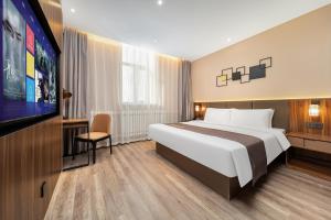 Voodi või voodid majutusasutuse HomeInn Selection Harbin Central Street Sophia Church toas