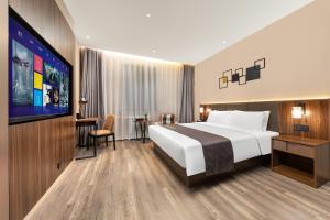 Voodi või voodid majutusasutuse HomeInn Selection Harbin Central Street Sophia Church toas
