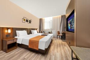 Voodi või voodid majutusasutuse HomeInn Selection Harbin Central Street Sophia Church toas