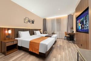 Voodi või voodid majutusasutuse HomeInn Selection Harbin Central Street Sophia Church toas