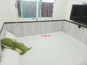 Ένα ή περισσότερα κρεβάτια σε δωμάτιο στο Xiaomi Courtyard B&B