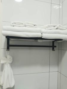 a bed on a shelf with towels on it at Xiaomi Courtyard B&B in Chishang