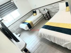 Ένα ή περισσότερα κρεβάτια σε δωμάτιο στο Xiaomi Courtyard B&B