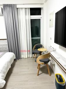 Ένα ή περισσότερα κρεβάτια σε δωμάτιο στο Xiaomi Courtyard B&B