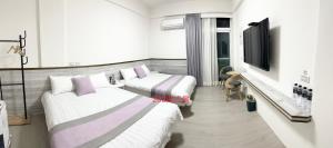 Ένα ή περισσότερα κρεβάτια σε δωμάτιο στο Xiaomi Courtyard B&B