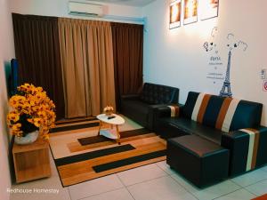a living room with a couch and a table at Dreamstay36 3R2B 8pax Meritus perai in Perai
