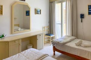 Postel nebo postele na pokoji v ubytování Seafront apartment in Gozo, Marsalforn - Happy Rentals