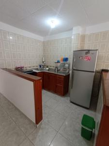 a kitchen with a refrigerator and a sink in it at Apartamento familiar San Gil in San Gil
