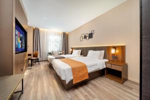 Voodi või voodid majutusasutuse HomeInn Selection Harbin Central Street Sophia Church toas