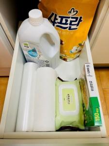 um frigorífico com papel higiénico e um galão de leite em Seohyeon station 2min Sunny house with beautiful view #Cozy place #the place of the art collector em Seongnam