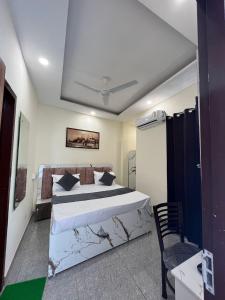 a bedroom with a large bed in a room at HOTEL THE GRAND REGENCY -- Luxury Rooms Stay -- Family, Couples, Corporate Special in Ludhiana