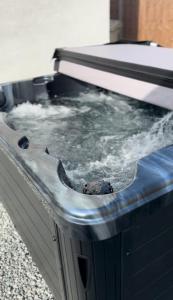 a hot tub with snow on top of it at Clarendon House - Hot Tub in Lincolnshire