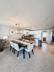 a kitchen and dining room with a table and chairs at Ultimate St. George Vacation Retreat! in St. George