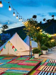 a tent on a rug with a view of a mountain at TP-HOMES PHAN THIẾT in Phan Thiet