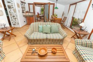 Predel za sedenje v nastanitvi Geräumiges Ferienhaus für zwei Personen mit eigenem Garten