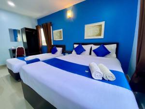 Ένα ή περισσότερα κρεβάτια σε δωμάτιο στο Royals Star Hotel +11 φωτογραφίες