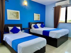 Ένα ή περισσότερα κρεβάτια σε δωμάτιο στο Royals Star Hotel