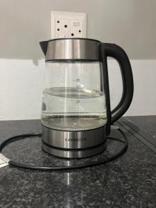a blender filled with water on top of a counter at Cliffside Cottage in Kloof