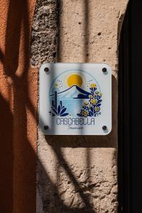 a sign on the side of a building at Cascabella Taormina in Taormina