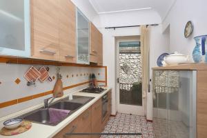a kitchen with a sink and a counter top at Casa Bella Capri in Capri