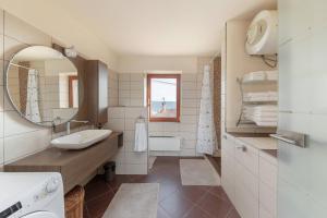 a bathroom with a sink and a mirror at Istrian House La Bora in Koper