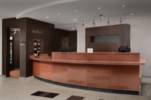 a lobby with a reception counter in a store at Courtyard by Marriott Panama City in Panama City