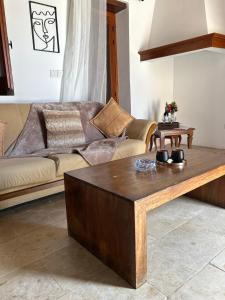a living room with a couch and a coffee table at The stone nest in Paphos