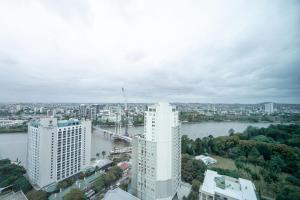 an aerial view of a large white building and a river at CBD Riverview 2B1B Apt w Shared Pool, Gym in Brisbane