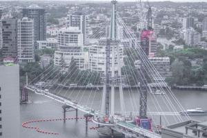 a bridge over a river with cars on it at CBD Riverview 2B1B Apt w Shared Pool, Gym in Brisbane