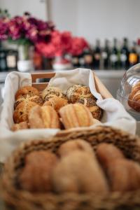a basket of pastries sitting on a table at Hotel Boutique Palacio Corredera in Jerez de la Frontera