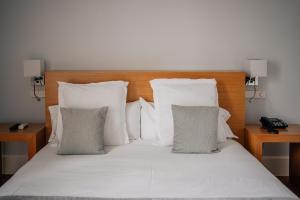 Postel nebo postele na pokoji v ubytování Hotel Boutique Palacio Corredera
