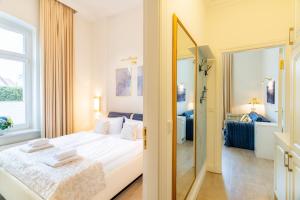 Ένα ή περισσότερα κρεβάτια σε δωμάτιο στο Villa Gruner App 1a +11 φωτογραφίες