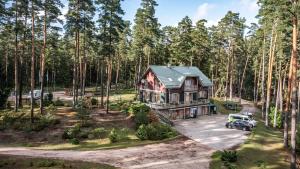 an aerial view of a house in the woods at LVM tūrisma un atpūtas centrs "Spāre" in Spāre