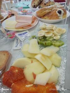 a table with a bunch of food on it at Maison De luxe in Pompei