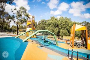 a swimming pool with a slide in a park at Brilliant Quay Boulevard Apt in Werribee South