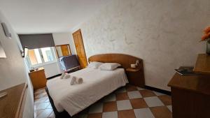 Postel nebo postele na pokoji v ubytování Hotel Montecodeno