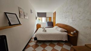 Postel nebo postele na pokoji v ubytování Hotel Montecodeno