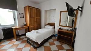 Postel nebo postele na pokoji v ubytování Hotel Montecodeno