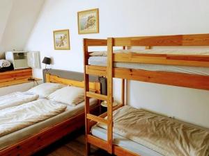 a bedroom with two bunk beds and a desk at Esztergom Central in Esztergom