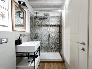 a bathroom with a shower and a sink at Free Parking - Modena Prestige, la Porta sul Centro in Modena