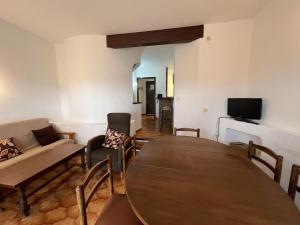 a living room with a table and a couch at Hermitage 98 House with 3 bedrooms in L'Estartit