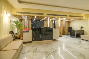 an office with a lobby with a reception desk at Parnil Palace in Guwahati