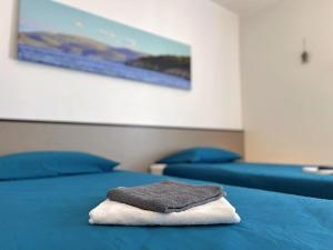 A bed or beds in a room at Apartments Neptun