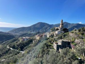 a small town on a hill with a church at La casa di Rosetta in Levanto