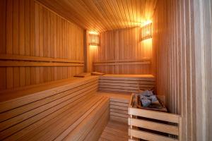 a sauna with wood paneling and a wooden floor at Villa Mariposa in Fethiye
