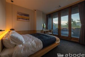 Ένα ή περισσότερα κρεβάτια σε δωμάτιο στο abode villa GORA 八代別邸