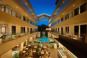 a view of the lobby of a hotel with a pool at The Acacia Hotel & Spa in Candolim