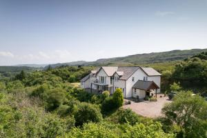 an aerial view of a house in the hills at Killoran House in Dervaig