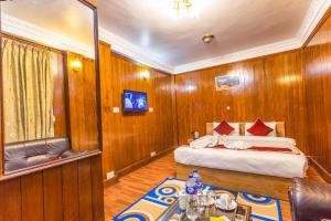 Un pat sau paturi într-o cameră la Hotel Sekai