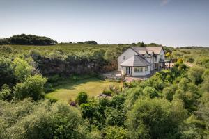 an aerial view of a house on a hill at Killoran House in Dervaig